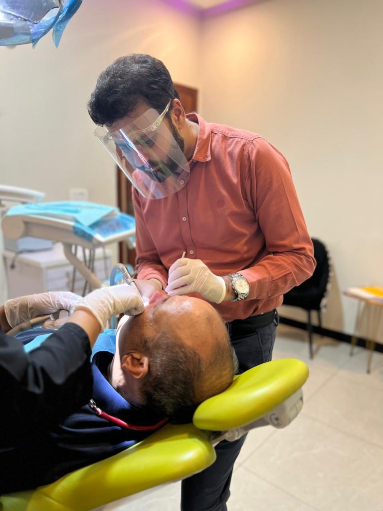 Discover the Best Dentist in Lahore: Dr. Aamir Rafiq at Dental Surgeons Clinic Dr Aamir Rafiq during dental treatment